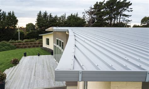 metal roof on t shaped house|curved roof shapes.